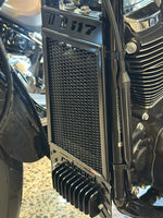 Close-up of a motorcycle radiator with visible branding of radguard for a Harley Davidson Heritage Classic 117 in the powder coated black