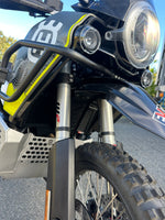 Close-up of a Husqvarna off-road motorcycle with front fender spacer kit installed
