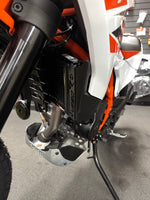 Close up and side view of the KTM 390 Enduro R fitted with a Rad Guard radiator guard fitted in black. 