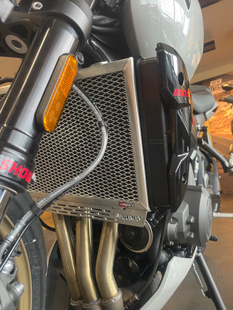 close up of the polished rad guard for the triumph trident 800 fitted, 